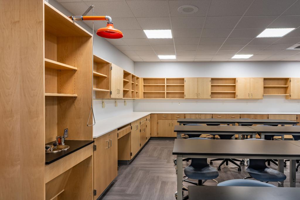 Wood laboratory casework cabinets and shelving in science lab setting